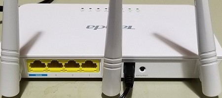 power cable plugged into back of router