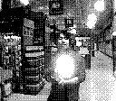 A game boy camera photo of a man holding a ball of light
