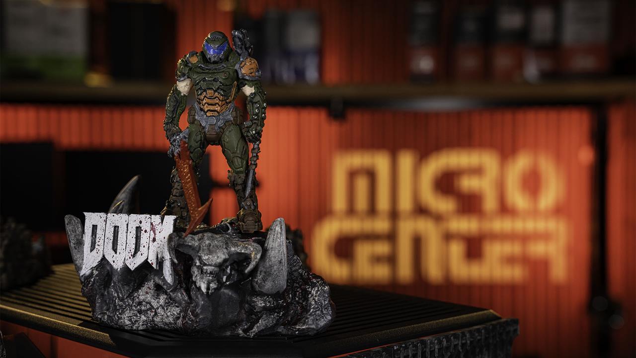 A 3D Printer Doom Slayer standing on a PC with MICRO CENTER in the background