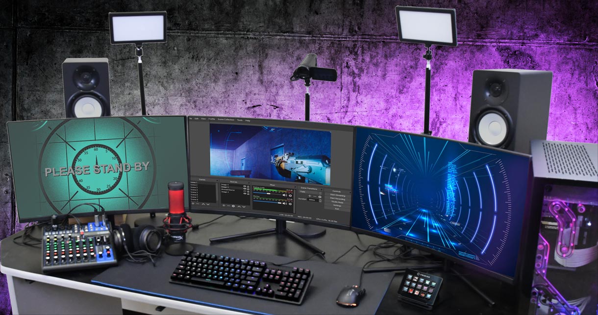 Streaming studio setup with three monitor, lights, speakers, mic, PowerSpec computer, camera, keyboard, mouse, stream deck