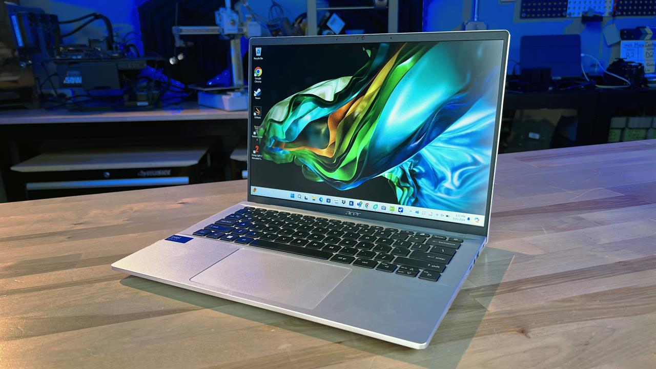 An Acer Swift Go 14 laptop sitting on a desk. 