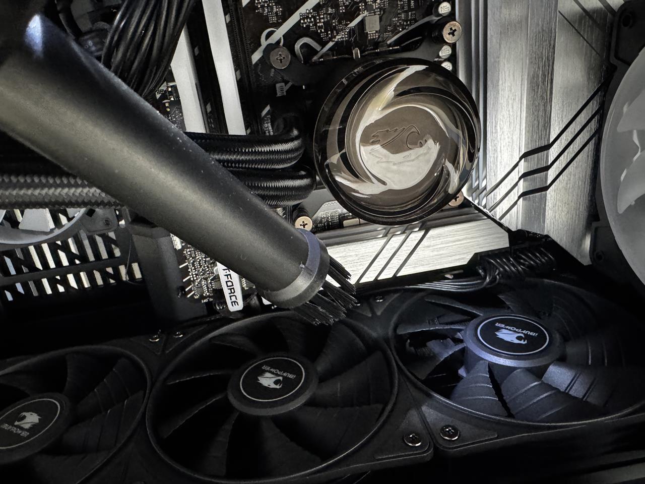 an air compressor blowing out a pc fan