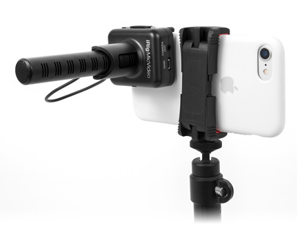 IK Multimedia iRig Mic Video Universal digital shotgun microphone attached to a smartphone on a tripod