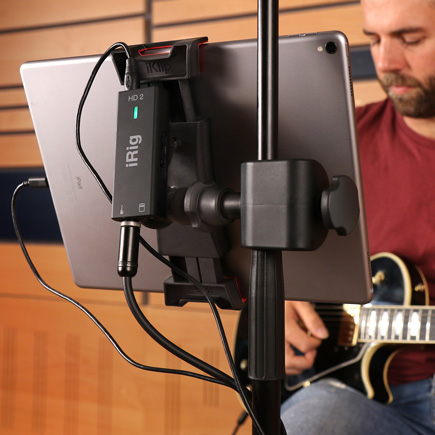 Guitar player using IK Multimedia iRig HD 2
