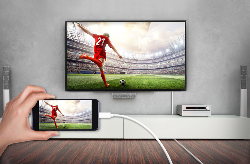 Big screen connected to a mobile phone. Both screens display the same image.