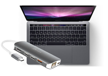Adapter pictured with MacBook Pro