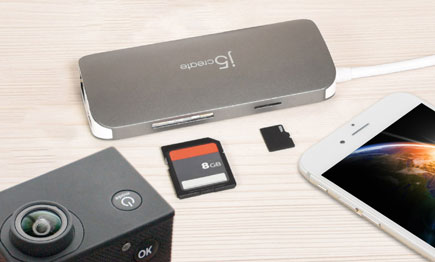 Adapter pictured with memory card and mobile phone