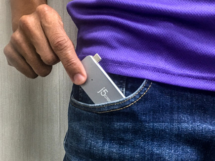 Dock shown being slipped into a front pants pocket
