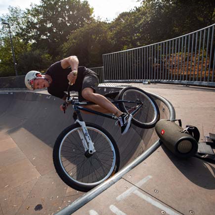 JBL Xtreme 2 speaker at the edge of a bike park rim