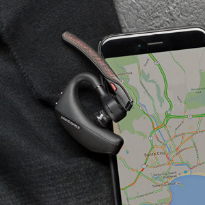  Plantronics Voyager 5200 Wireless headset lying on a map displayed on a cell phone.