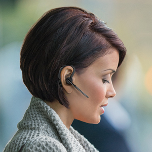 Woman using the Plantronics Voyager Legend Single Ear Mobile/Wireless Bluetooth headset