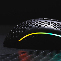 Closeup of Redragon M808 RGB Storm Honeycomb styling