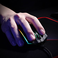 User engaged with the vampire elite wireless gaming mouse.