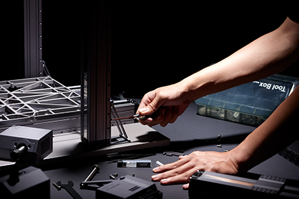 Person assembling the Snapmaker 2.0 original 3D printer.