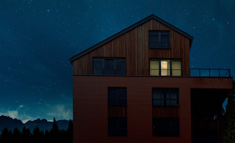 House with lighted window