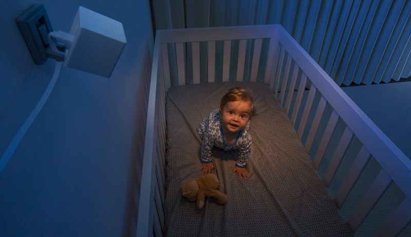 Baby in a crib at night