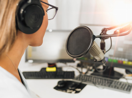 Woman recording a podcast