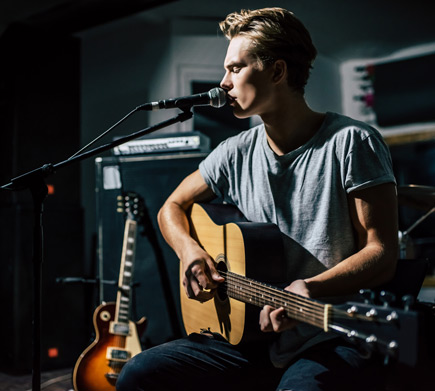 Guy Guy singing in a recording studio