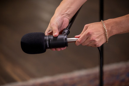 Close up of the Zoom ZDM-1 Podcast Mic Pack microphone on a floor stand