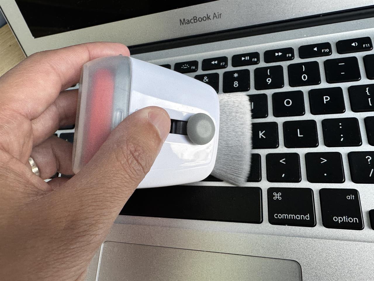a macbook being brushed