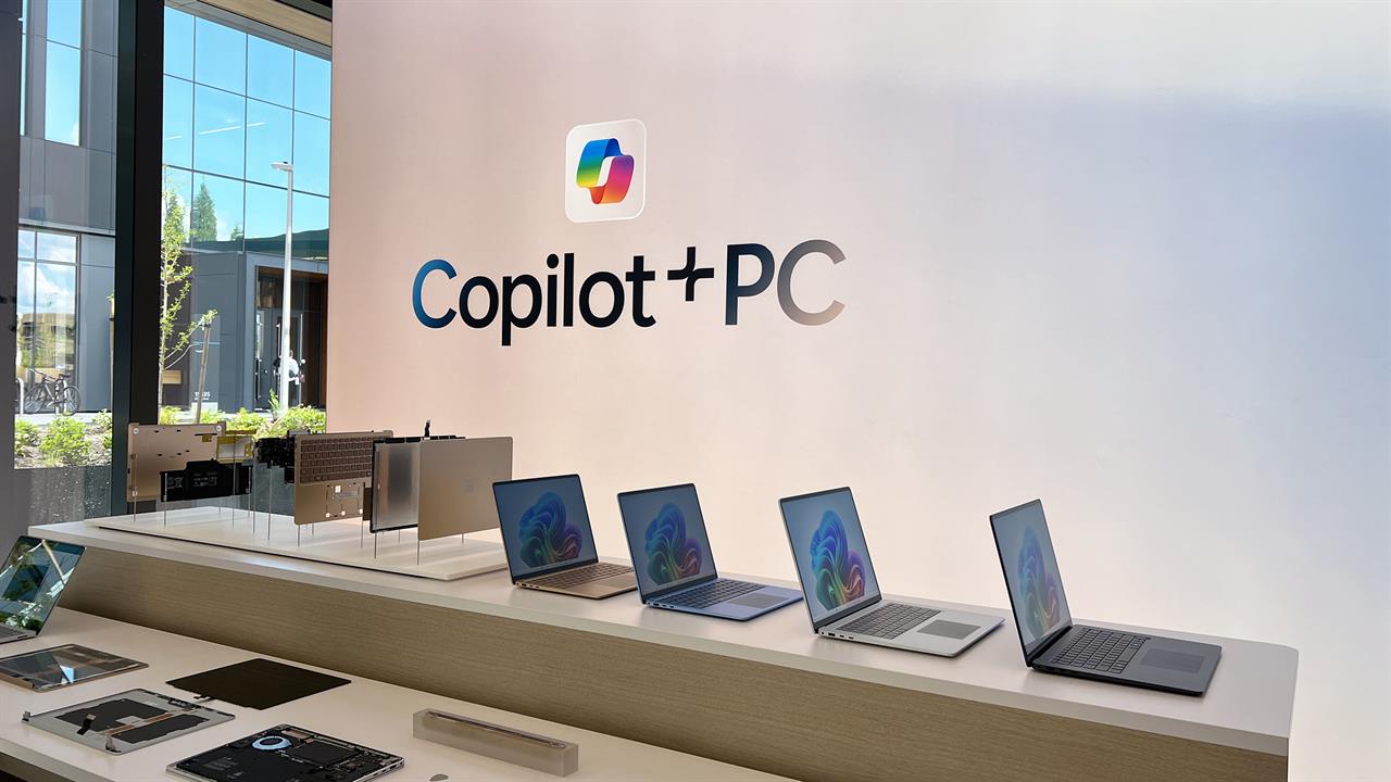A table of laptop at a Microsoft showcase. 