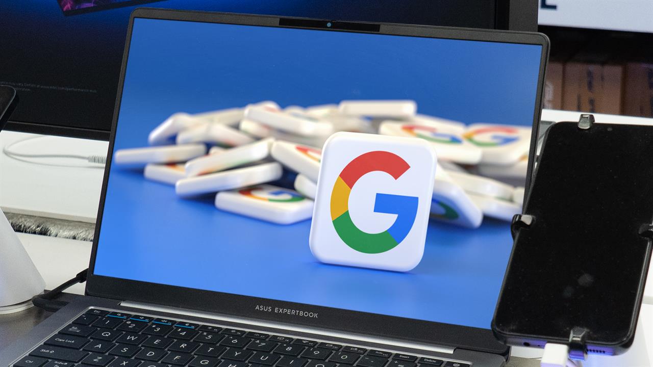 A laptop showing a Google logo. 