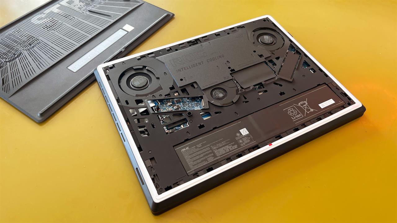 An image of a laptop open, to expose the battery 