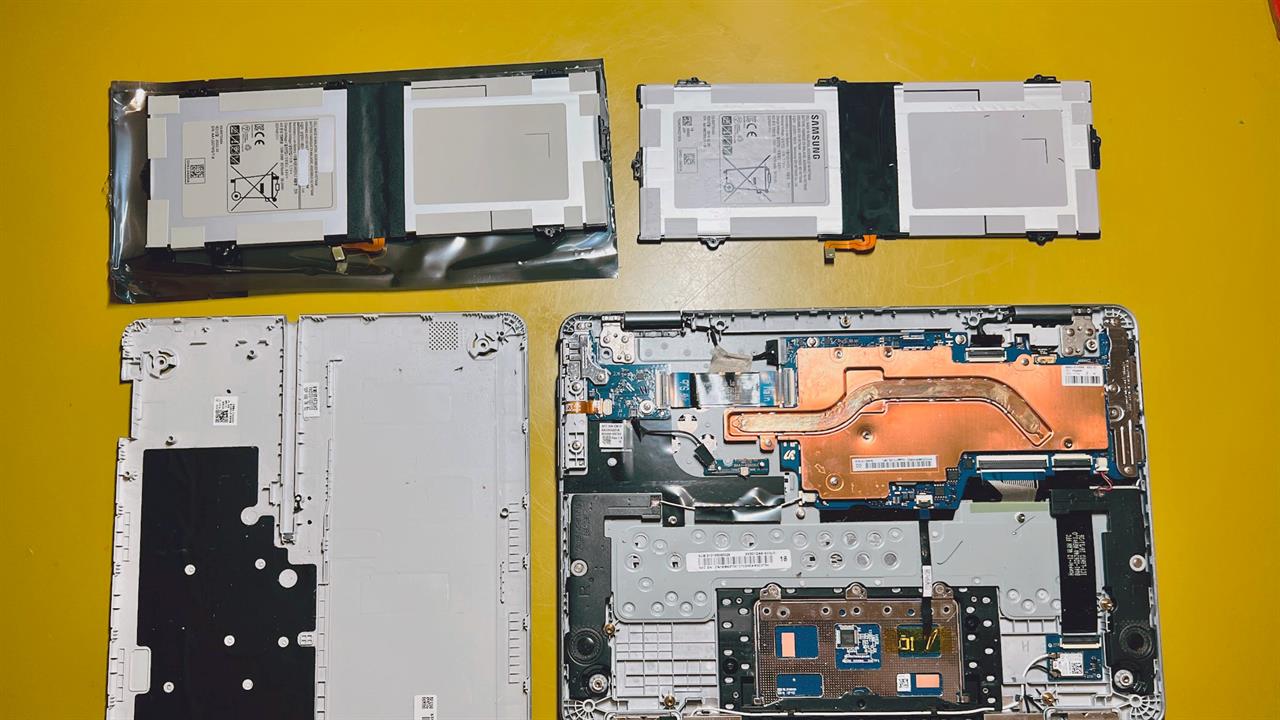 A laptop battery being replaced.