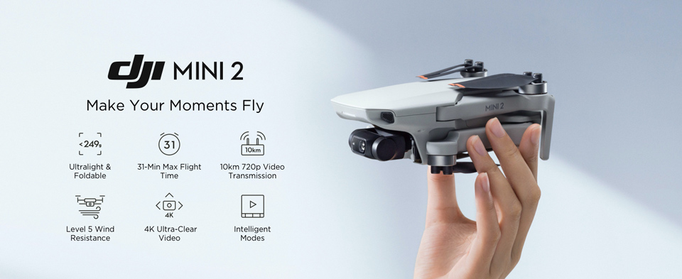 DJI Mini 2 - Make Moments Fly. Ultralight and foldable. 31-min max flight time. 10km 720p video transmission. Level 5 wind resistance. 4k ultra clear video. Intelligent modes