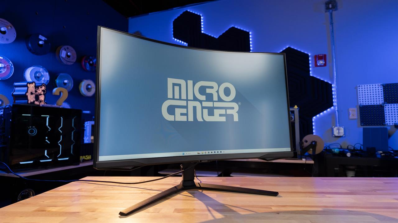 A large, curved-screen computer monitor. 